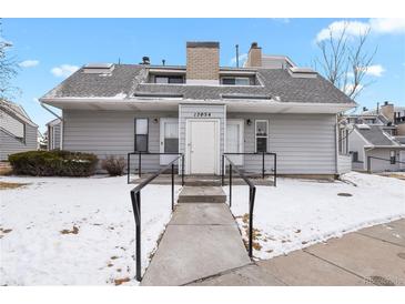 Charming condo exterior with a welcoming walkway leading to the front door at 17054 E Tennessee Dr # 104, Aurora, CO 80017