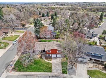 Charming two-story home boasting a mature, lush landscape and a two car garage at 8320 W Harvard Dr, Lakewood, CO 80227