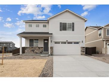 Charming two-story home with stone accents and a spacious two-car garage at 760 N Deer Park St, Watkins, CO 80137