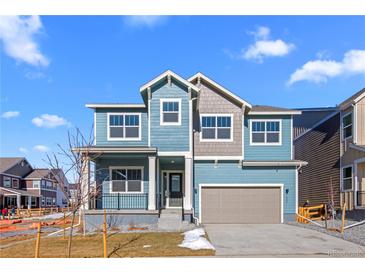 Charming two-story home with a welcoming front porch and attached two-car garage at 5625 W 141St Ln, Broomfield, CO 80020