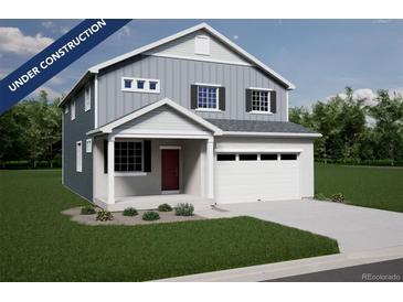 Two-story home with gray siding, red door, and two-car garage at 3948 N Riviera Ct, Aurora, CO 80019