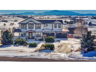 Stunning two-story home with mountain views and a spacious driveway at 33100 Ridgeview Loop, Elizabeth, CO 80107