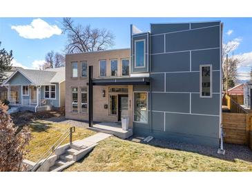 Modern home exterior with beige brick and gray siding, showcasing a walkway and well-manicured lawn at 4351 Yates St, Denver, CO 80212