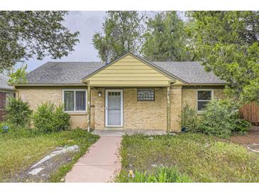 Charming single-story brick home with a covered porch, walkway, and mature trees in a quiet neighborhood at 1691 Poplar St, Denver, CO 80220