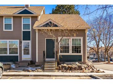 Charming townhouse showcasing a well-maintained exterior with inviting front entrance and landscaped surroundings at 11542 Community Center Dr # 56, Northglenn, CO 80233
