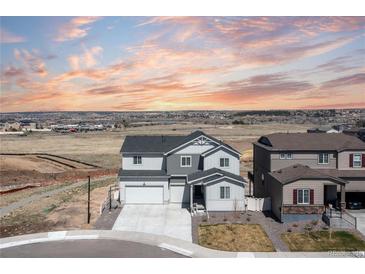 Beautiful exterior view of a modern two-story home featuring well-maintained landscaping and neighborhood views at 17851 Herrera Dr, Parker, CO 80134
