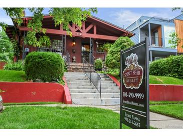 Charming brick home with eye-catching curb appeal and professional real estate signage at 2131 Eliot St, Denver, CO 80211