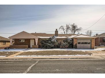 Charming brick home featuring an attached garage and a well-maintained front yard at 1330 E 90Th Ave, Thornton, CO 80229