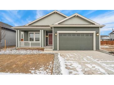 Charming single-Gathering home with attached two-car garage and covered porch entrance at 1595 Orchard St, Brighton, CO 80601