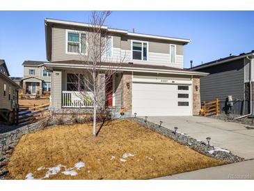 Two-story house with attached garage and landscaped front yard at 21837 E Stanford Cir, Aurora, CO 80015