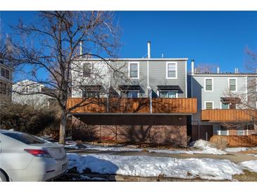 Charming townhome featuring a brick facade, gray siding, wood balconies and a bright, inviting exterior at 1111 Maxwell Ave # 233, Boulder, CO 80304