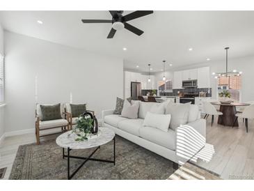 Spacious living room with a comfortable sofa and a modern coffee table at 1835 S Lincoln St, Denver, CO 80210