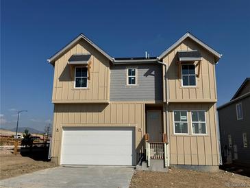 Charming two-story home with a two-car garage and modern architectural details at 16947 W 92Nd Dr, Arvada, CO 80007