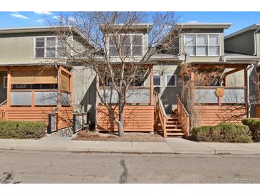 Charming townhome featuring private front porches with wooden accents and low-maintenance landscaping at 3223 Iron Forge Pl # 108, Boulder, CO 80301