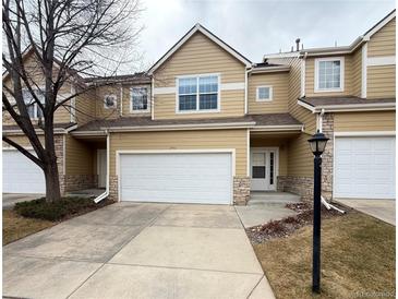 Charming townhome boasts a two-car garage and welcoming front entrance at 246 Rockview Dr, Superior, CO 80027