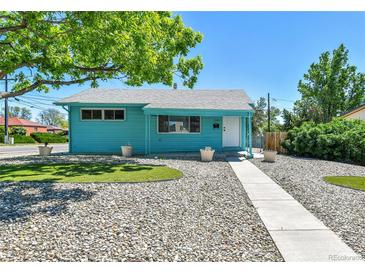 Charming blue single-story home with manicured lawn, rock landscaping, and a bright and welcoming exterior at 1500 S Wolcott Ct, Denver, CO 80219