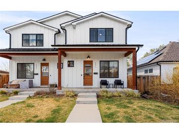 Charming exterior of a modern two-story home with a covered porch and well-maintained lawn at 2571 S Cherokee St, Denver, CO 80223