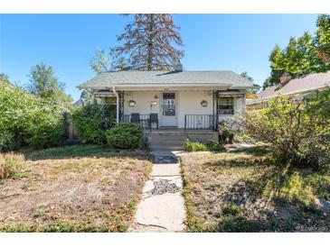 Charming single-story home with a welcoming front porch and well-maintained landscaping at 4110 Yates St, Denver, CO 80212