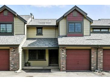 Charming townhouse with a well-maintained exterior and attached garage, located at number 34 at 10842 W Evans Ave # 34, Lakewood, CO 80227