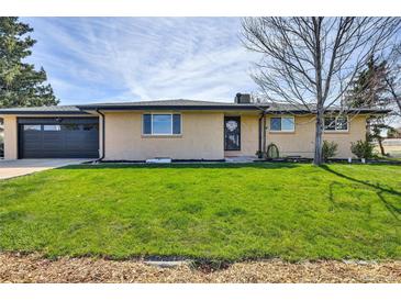 Charming ranch-style home with a well-manicured lawn and inviting curb appeal at 16816 E Costilla Ave, Foxfield, CO 80016