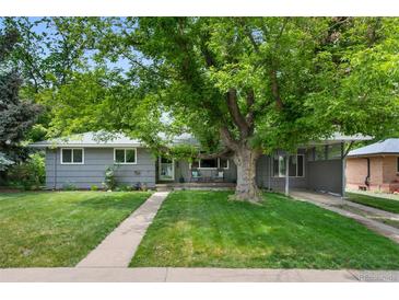 Charming single story home with a large shade tree and welcoming front yard at 6283 S Prescott St, Littleton, CO 80120