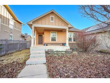 Charming single-Gathering home with a welcoming front porch and tidy landscaping at 23317 E Saratoga Cir, Aurora, CO 80016
