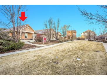 Charming single-story home with a well-maintained front yard and mature trees at 23317 E Saratoga Cir, Aurora, CO 80016