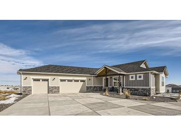 Beautiful ranch home with three-car garage, stone accents, and landscaped entry at 229 High Meadows Loop, Elizabeth, CO 80107