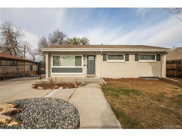 Charming single-story home featuring a well-maintained front yard, neutral paint, and inviting front door at 8511 Cherry Ln, Westminster, CO 80031