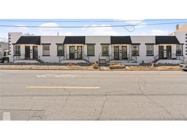 Charming row of homes featuring black and white exterior, private entrances, and convenient street access at 120 W Bayaud Ave, Denver, CO 80223