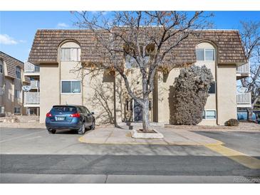 Attractive exterior of a multi-unit building with parking at 7645 E Quincy Ave # 105, Denver, CO 80237