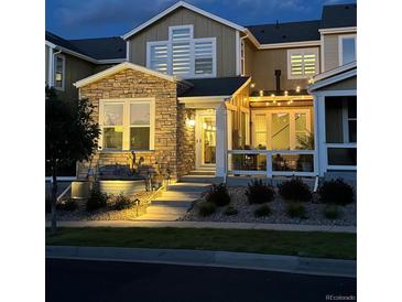 Attractive two-story home with stone accents and a charming patio at 14204 W 88Th Dr # C, Arvada, CO 80005