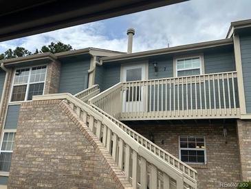 Inviting condo exterior featuring a private balcony, well-maintained siding, and convenient stair access at 2690 E Otero Pl # 7, Centennial, CO 80122