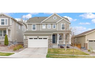 Charming two-story home with a well-manicured lawn and a two-car garage, perfect for suburban living at 16108 Red Bud Loop, Parker, CO 80134
