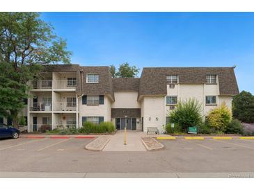 Exterior view of a well-maintained two-story apartment building with manicured landscaping at 5995 E Iliff-1 Ave # 309, Denver, CO 80222