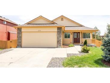 Inviting single-Gathering home featuring a two-car garage and well-maintained front lawn at 2140 Santa Fe Dr, Longmont, CO 80504