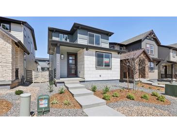 Charming two-story home with landscaped front yard and modern architectural details at 7241 Goldbloom Ln, Littleton, CO 80125