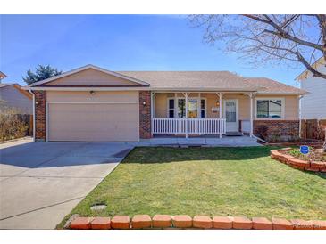 Charming single-Gathering home with a covered porch, well-manicured lawn, and attached garage, ready for its new owners at 10142 Josephine St, Thornton, CO 80229