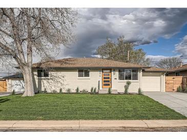 Charming single-story home featuring a freshly manicured lawn, newer windows, and an eye-catching orange-colored front door at 2076 S Yates St, Denver, CO 80219