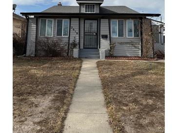Charming single-Gathering home featuring a well-maintained front yard and inviting entrance at 2619 S Bannock St, Denver, CO 80223