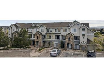 Charming townhouse with stone accents and a well-maintained front exterior in a desirable community at 479 Black Feather Loop # 311, Castle Rock, CO 80104