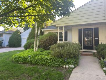 Charming home with a well-maintained front yard and walkway leading to the inviting front entrance at 3201 S Albion St, Denver, CO 80222