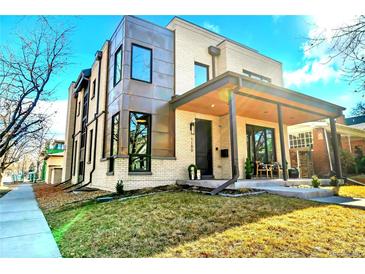 Striking modern exterior showcasing clean lines, mixed materials, and a welcoming covered front porch at 1100 S Gilpin St, Denver, CO 80210