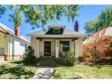 Charming bungalow with a well-maintained lawn and inviting front porch, perfect for enjoying quiet evenings at 284 S Lafayette St, Denver, CO 80209
