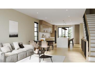 Open floor plan boasts modern kitchen with island and adjacent living area at 4640 Tennyson St # 29, Denver, CO 80212