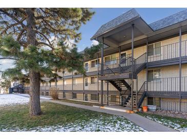 Attractive exterior of a multi-unit building with landscaping and stairs at 1723 Robb St # 20, Lakewood, CO 80215