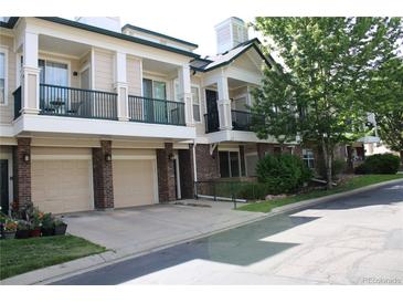 Inviting condo with charming balconies, front-facing garages and attractive brick accents at 1659 Harris St, Superior, CO 80027