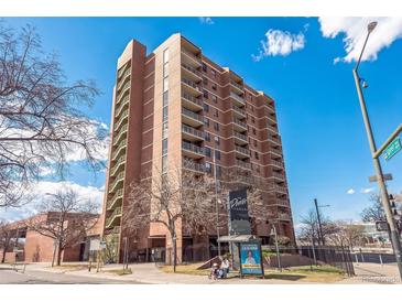 Brick apartment building featuring multiple stories, balconies, and convenient access to public transportation at 1301 Speer Blvd # 309, Denver, CO 80204