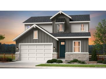 Charming two-story home with a welcoming facade, a two car garage, and meticulous landscaping at 3343 N Catawba Way, Aurora, CO 80019
