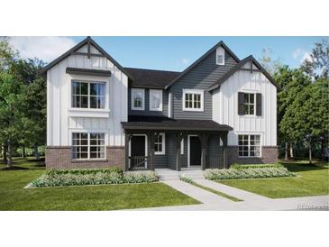 Charming modern two-story home featuring a landscaped yard, and a delightful covered entry at 15218 Detroit St, Thornton, CO 80602